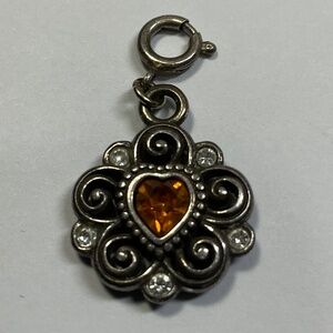Silver tone heart shaped amber stone pendant